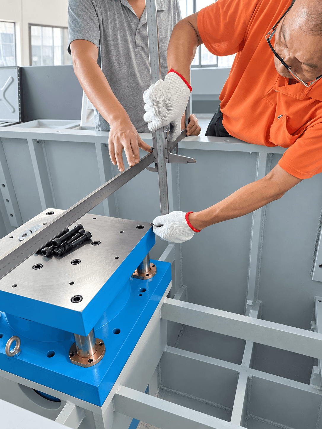 VICSTARS team checking machine dimensions with precision measuring tools