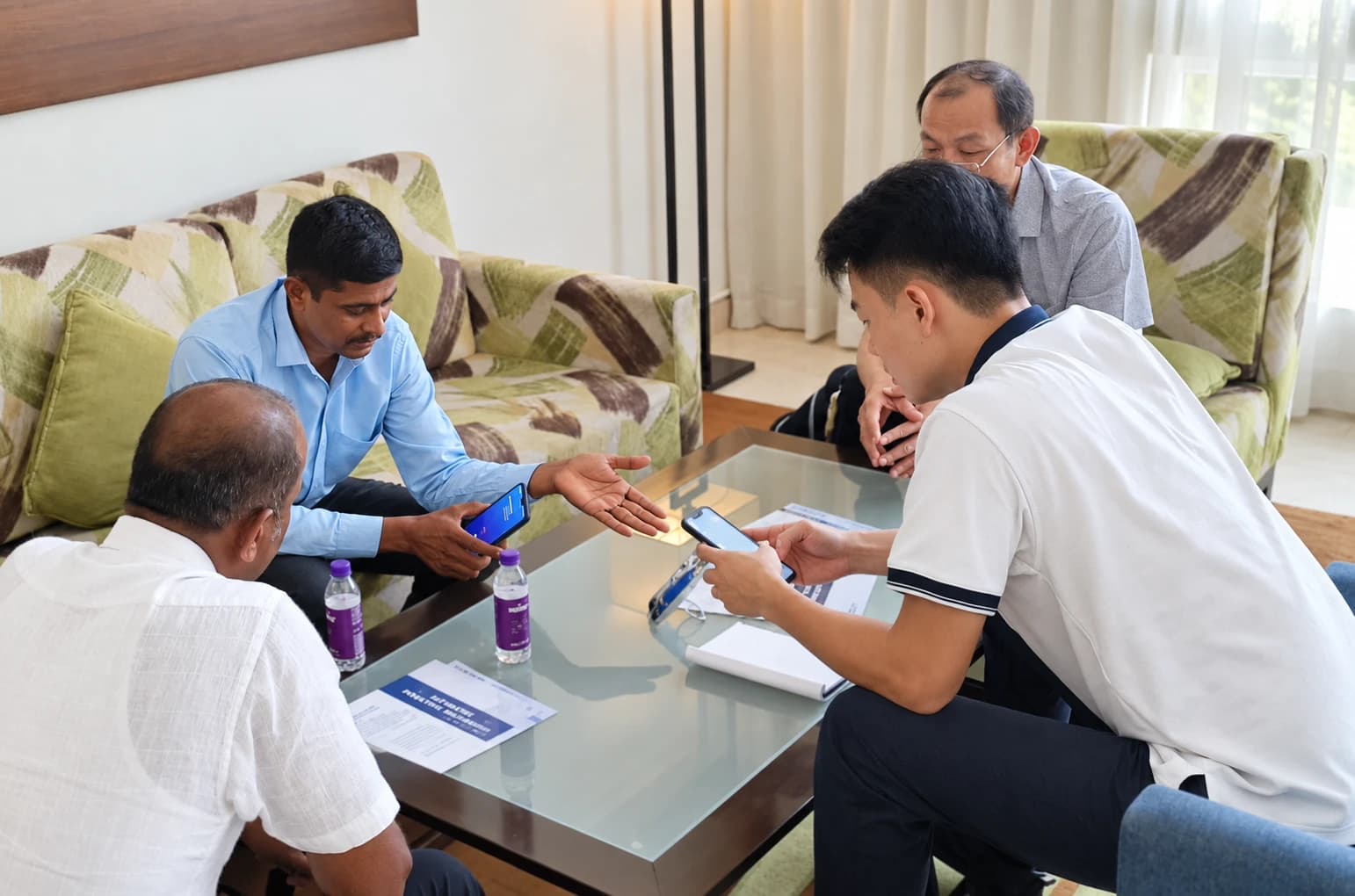 VICSTARS team and customers discussing manufacturing information around a table